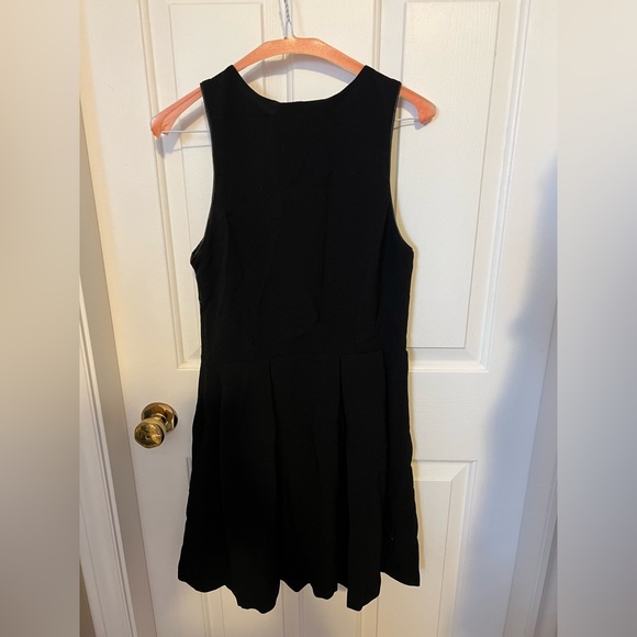 Black Sleeveless Mini Dress with Front Zipper - Picture 2 of 8
